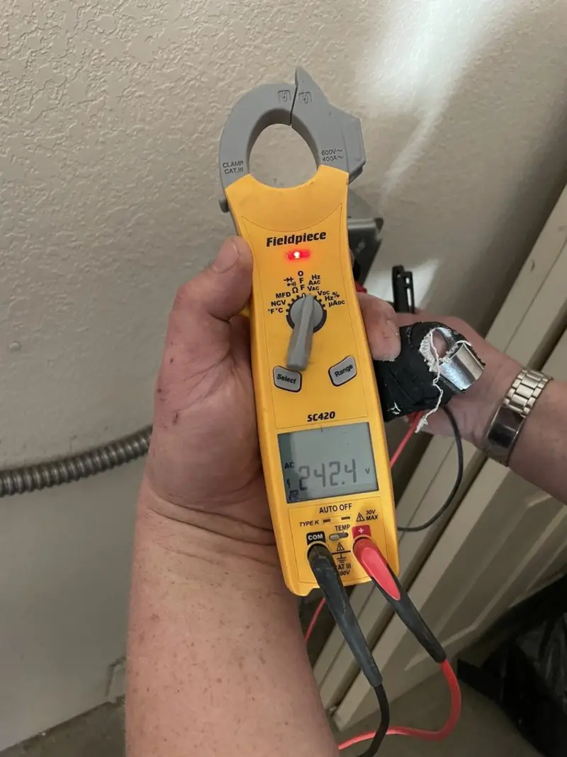Voltage testing with clamp meter during Ceiling Fan Installation in Flower Hill